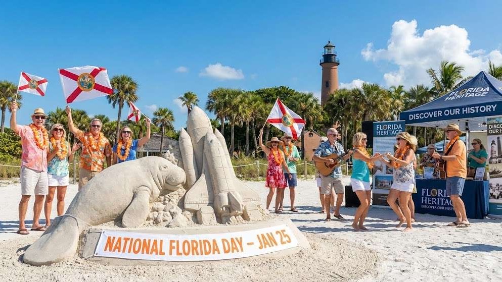 National Florida Day welcome sign against lush greenery and clear sky.