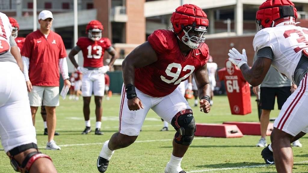 Arkansas football transfer Terence Roberson Jr. event celebration in sports arena.
