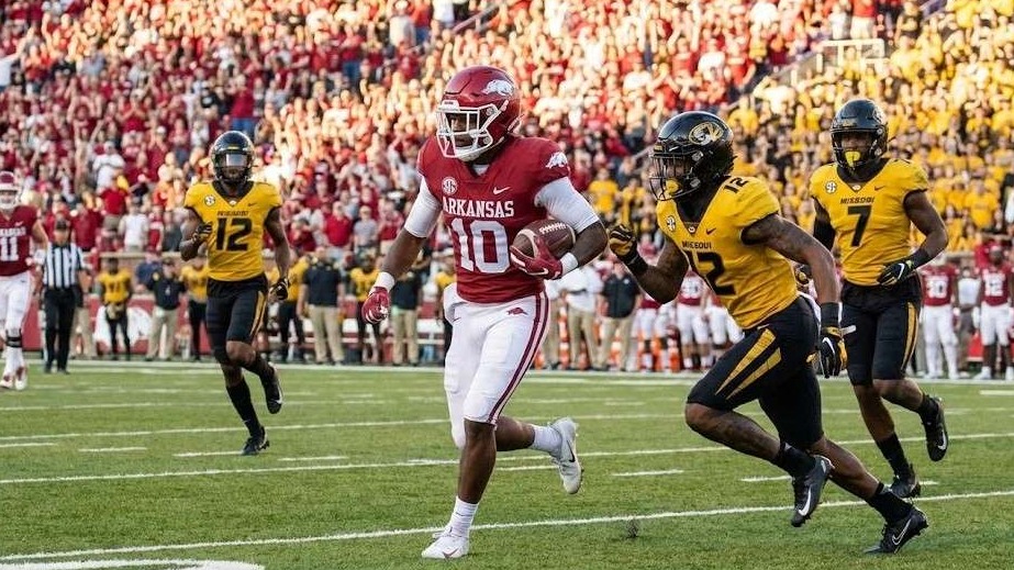 Arkansas Razorbacks Football vibrant stadium scene with crowd.