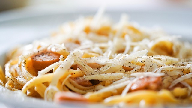 Young woman speaking in warm, cozy restaurant interior at Aunt Alice Venesian Inn Tontitown.