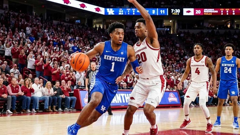 Kentucky hands Arkansas first home loss, intense basketball moment.