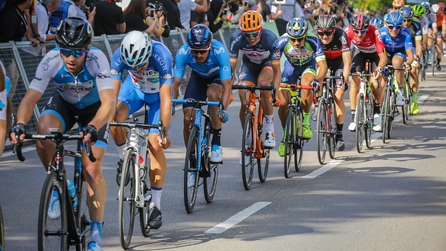 Cyclist prepares for USA Paracycling Road Championships in parking area.