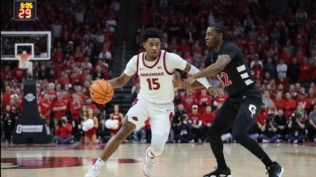 Arkansas Basketball Exhibition Win celebration in crowded arena.