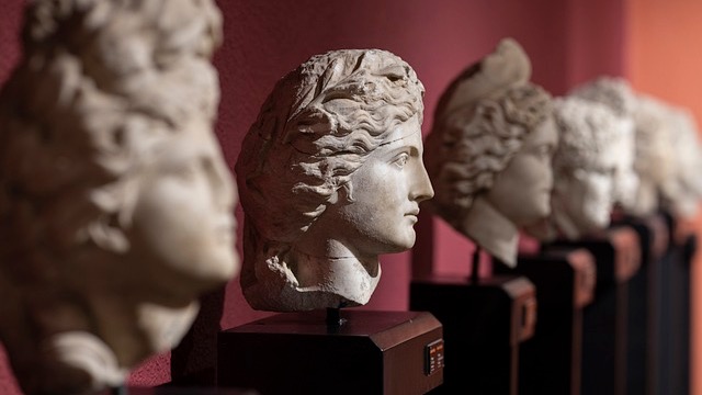 International Museum Day in a hall with classical sculptures.