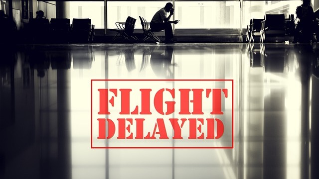 Travelers in a busy airport terminal affected by 17,000 flights delayed or canceled.