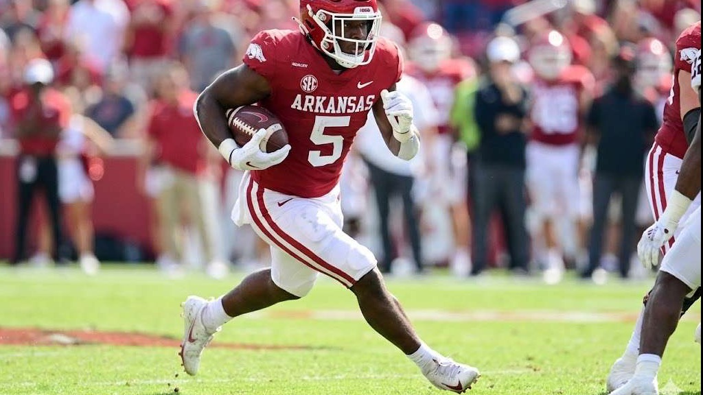 Arkansas Razorbacks performance in SEC broadcast graphic with animated coach.