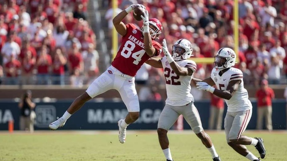 Arkansas Razorbacks football game atmosphere in packed stadium.