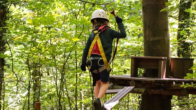 Man smiling indoors at 8th Street Park Opening announcement.