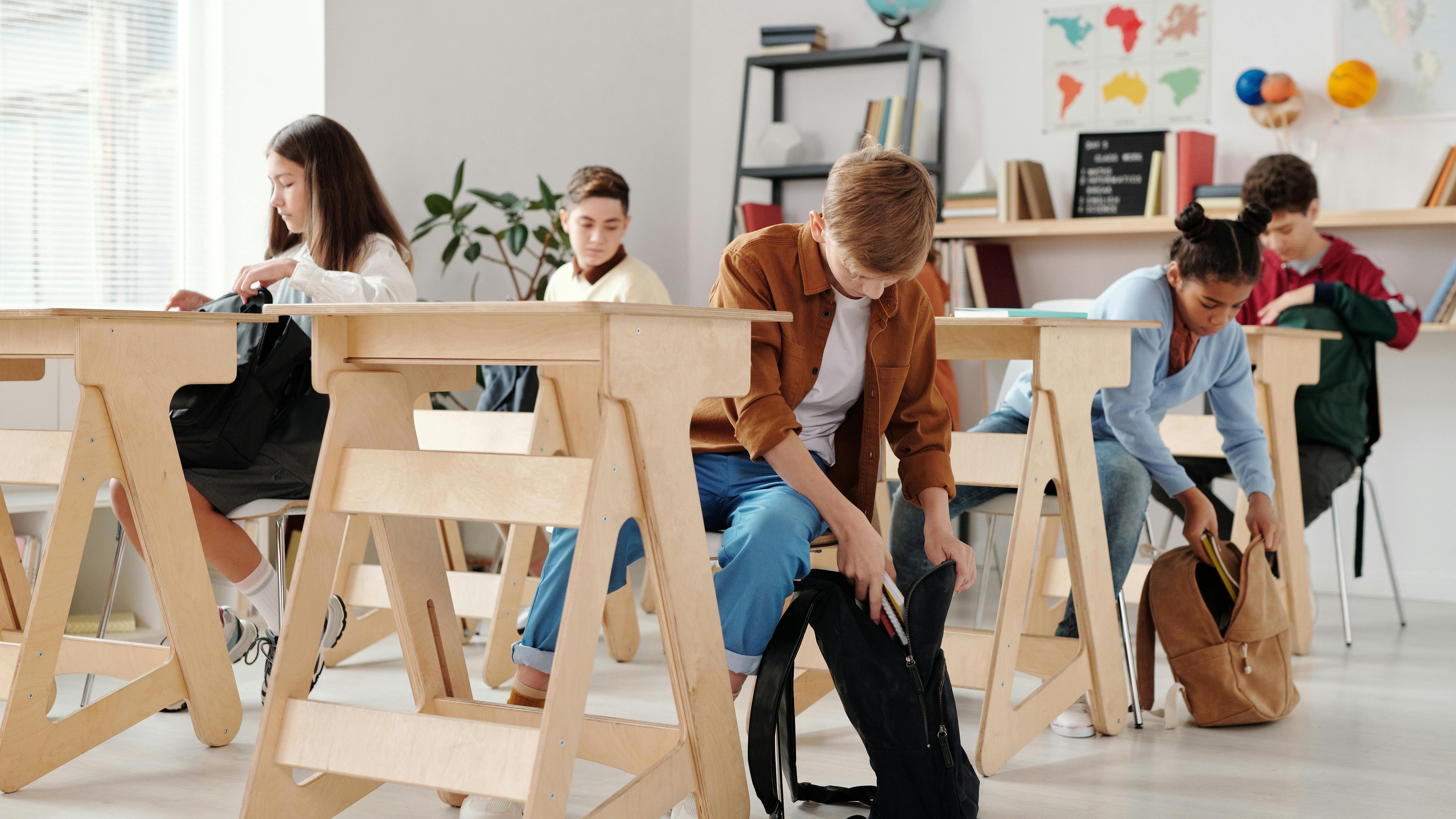 Students discussing education funding in Arkansas classroom.