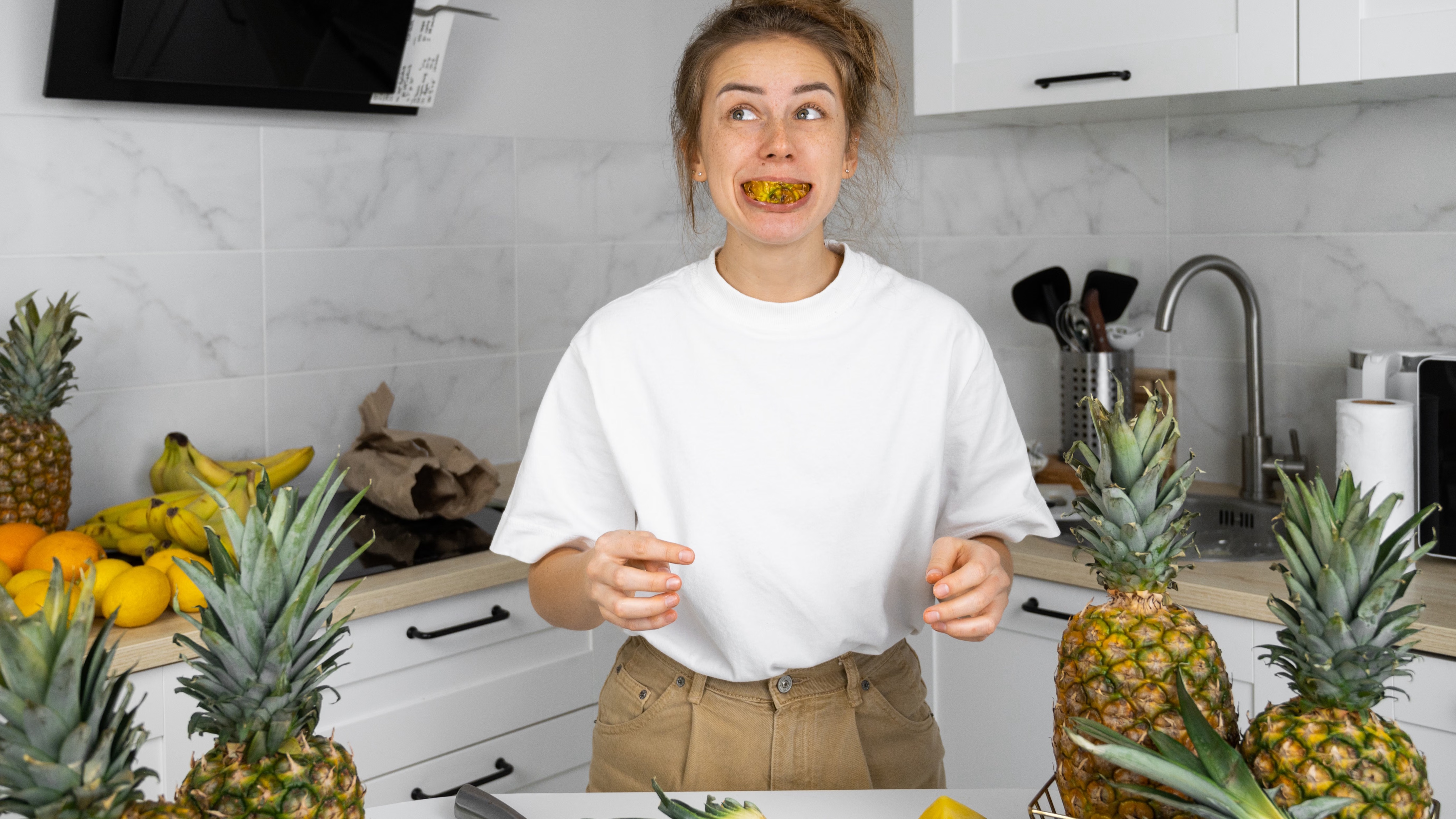 How do you feel about pineapple in the kitchen scene with woman preparing food.