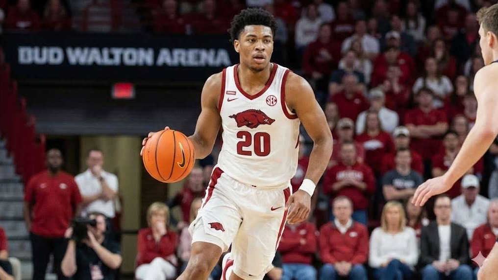Arkansas Razorbacks basketball players celebrate victory in Starkville.