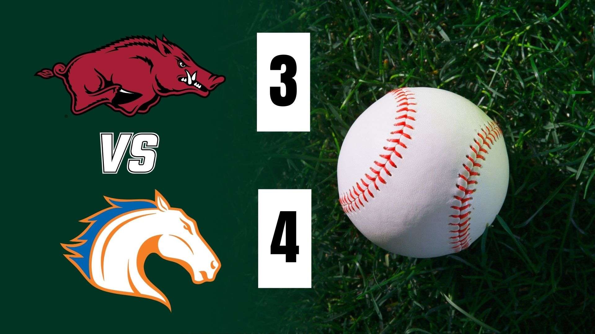 Arkansas baseball coach in uniform at the dugout.
