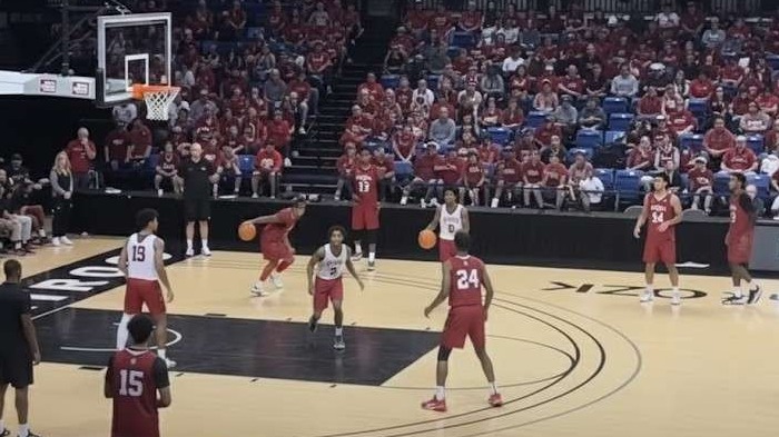 Arkansas Basketball Scrimmages in action with lively crowd.