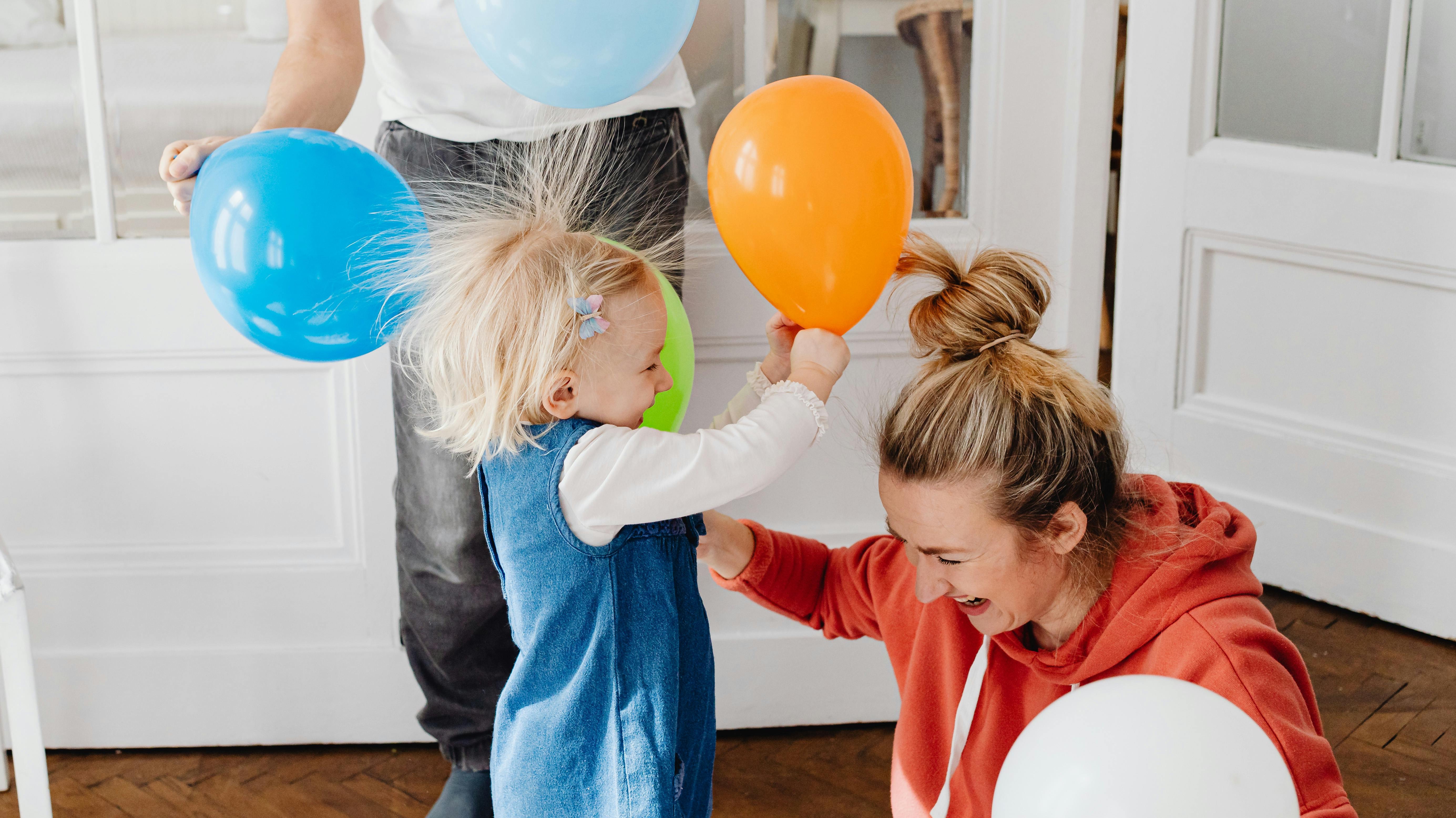 Child experiencing static electricity effect, National Static Electricity Day celebration.