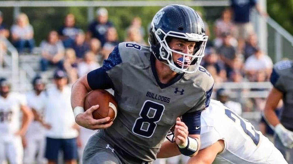 Major Changes in Athlete Recruitment: Focused football player during an interview.