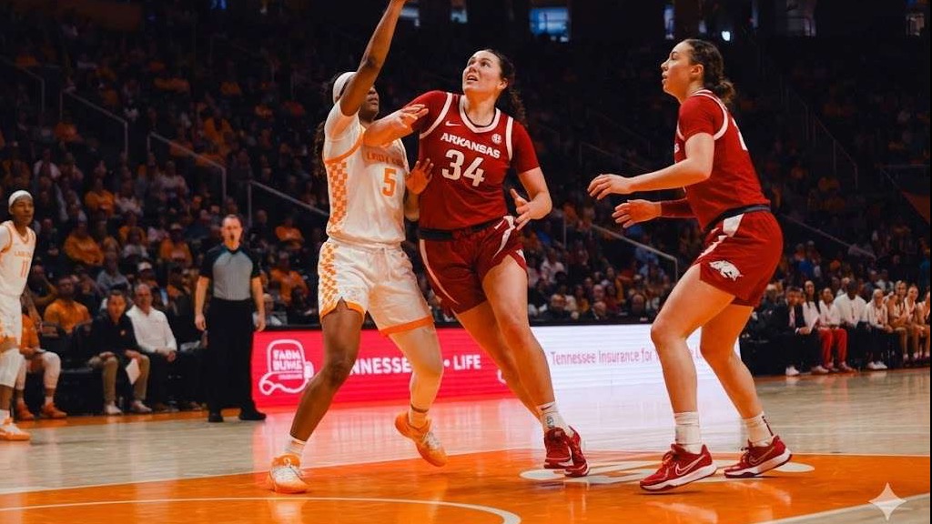 Arkansas Women’s Basketball vs Georgia players huddling mid-game.