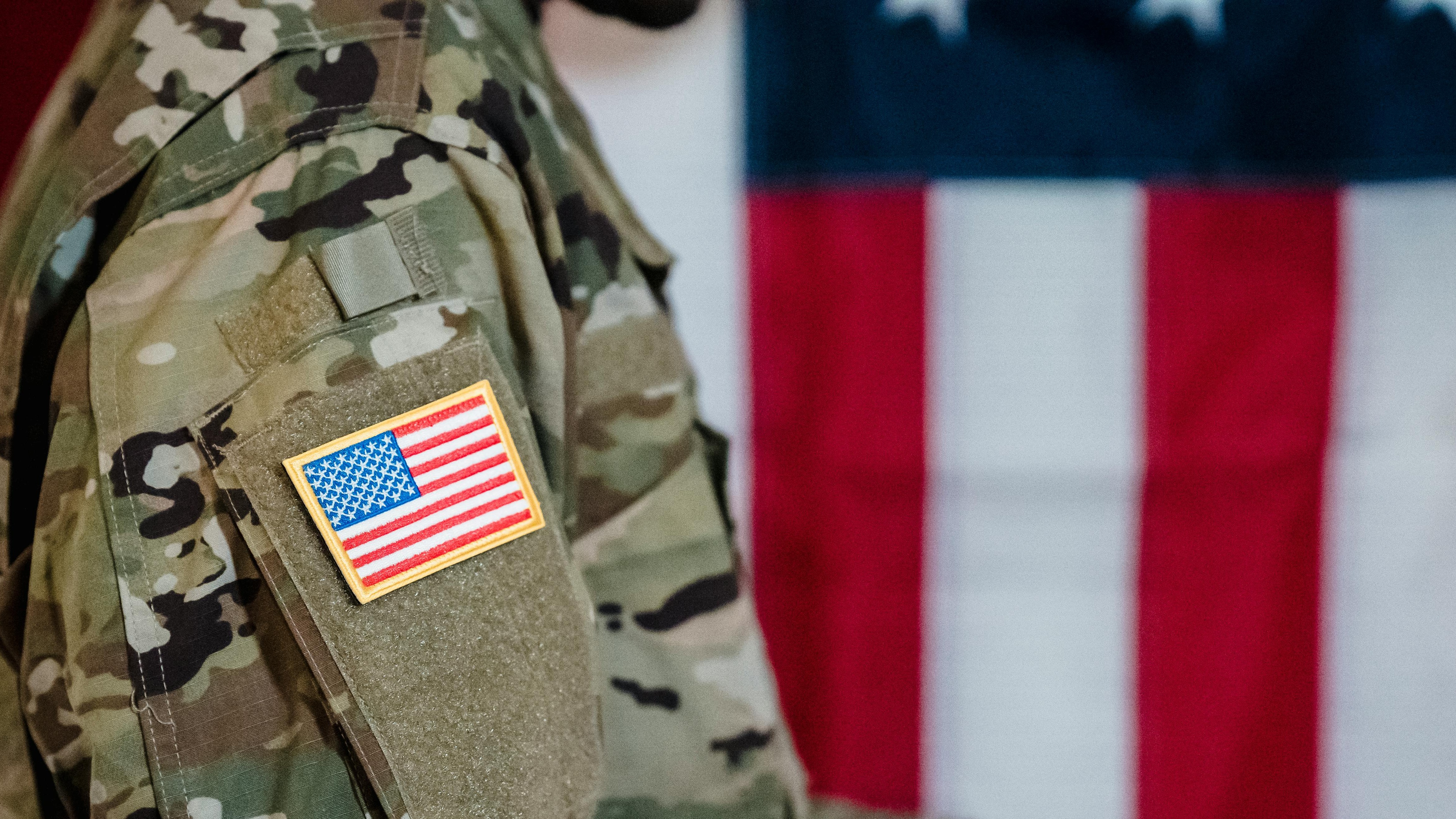 Arkansas National Guard Deployment Ceremony with speaker at podium.
