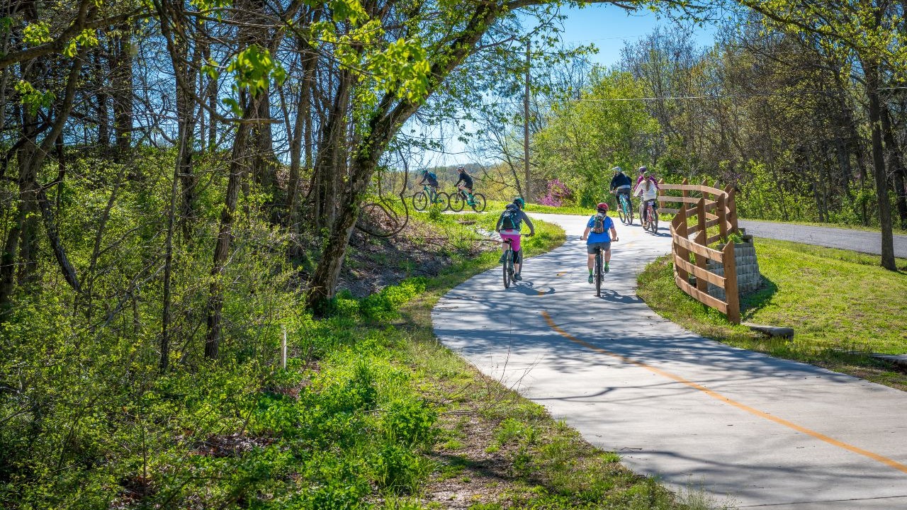 Family enjoying bike ride on a bicycle trail in Bella Vista, AR