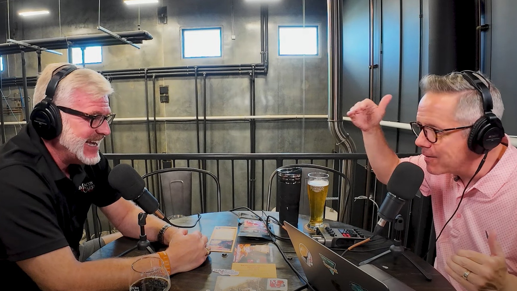 Podcast discussion with RG Min and Carson Apple Brandy in industrial setting.