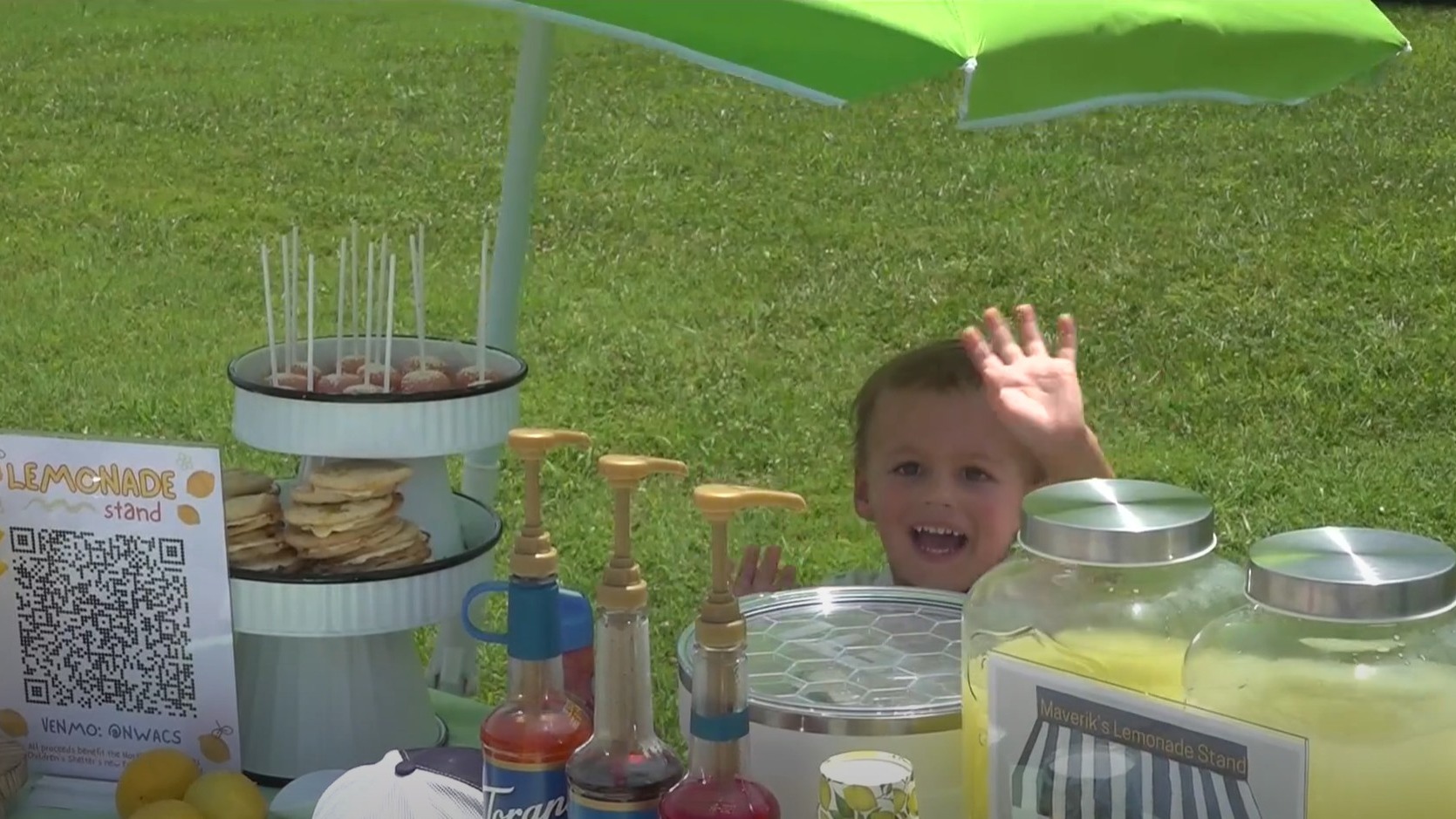 A 3 year boy selling lemonade