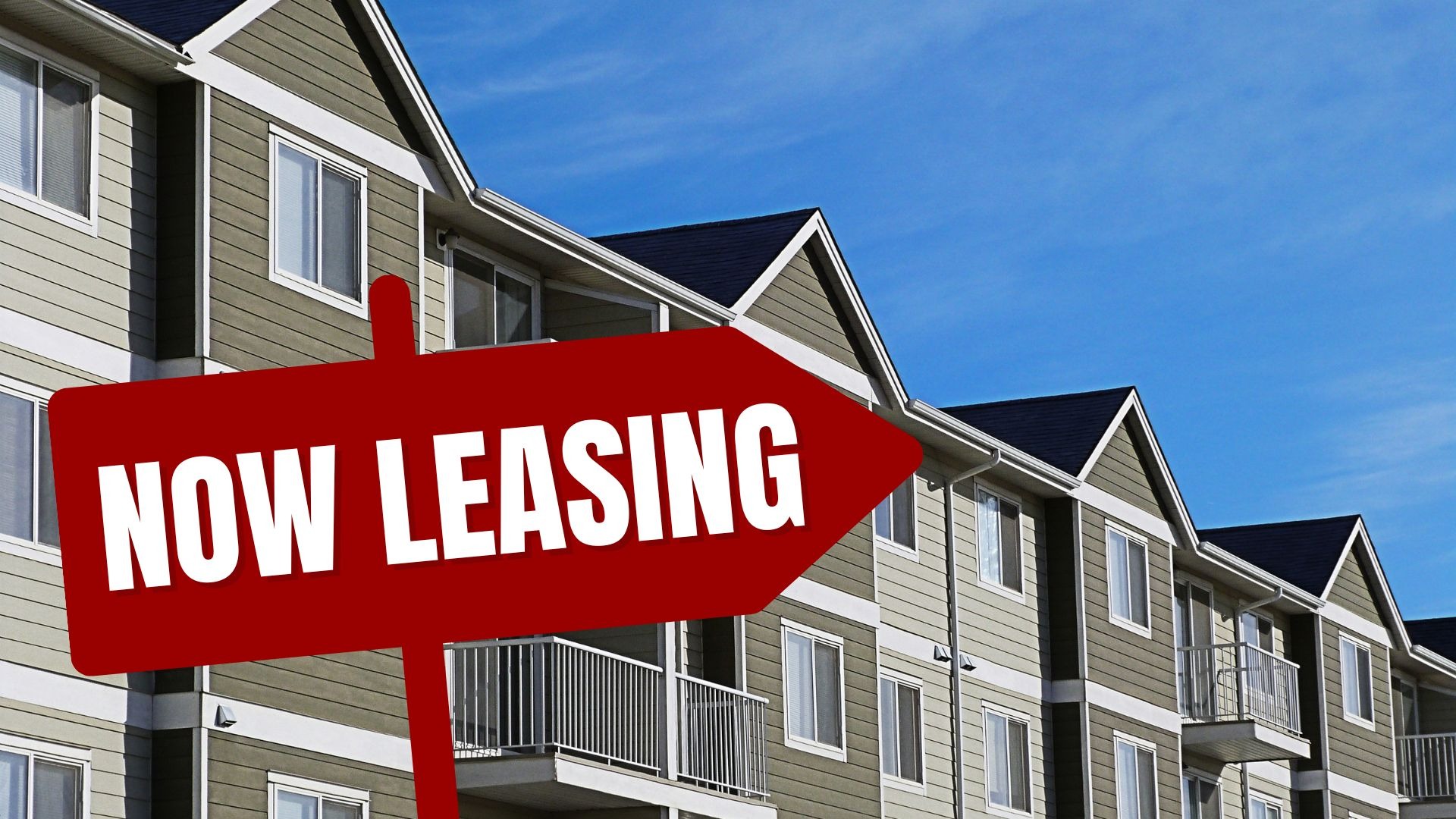 Leasing sign for Fayetteville student housing project surrounded by greenery.