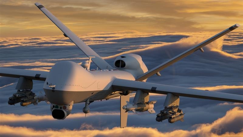 Top remotely piloted attack squadron jet flying against a cloudy sky