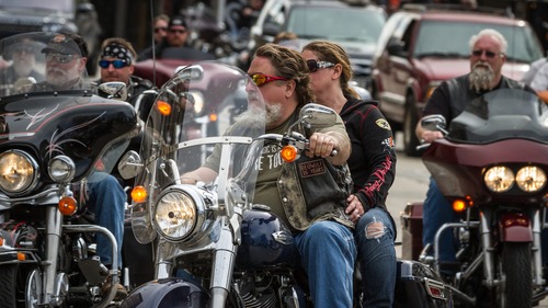 Dynamic poster for Bikes, Blues, and Barbecue Rally in Northwest Arkansas.