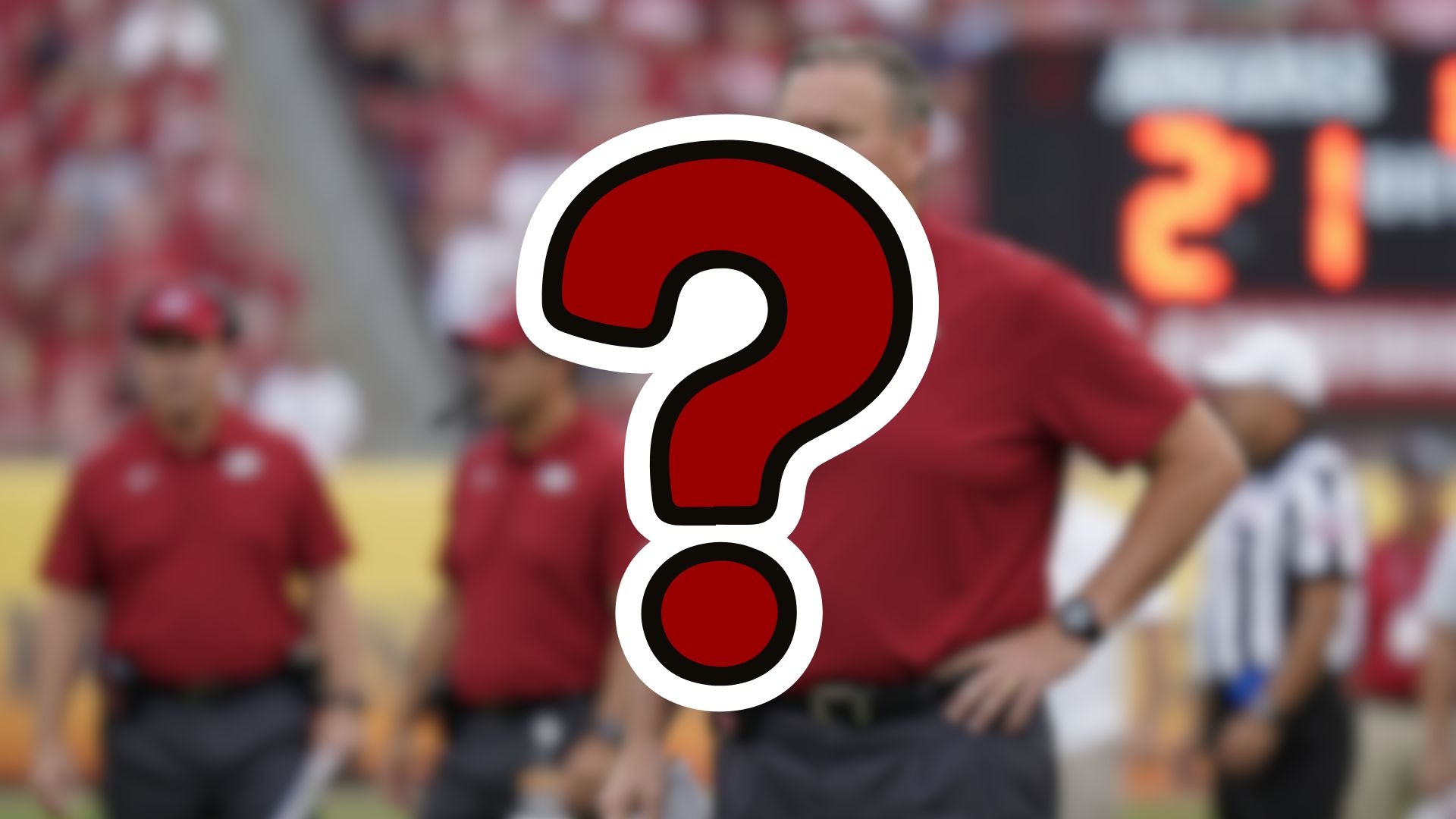 Arkansas Razorbacks Coaching Search Insights, coach pondering on field.