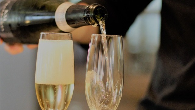 Celebratory champagne glasses and bottle for National Champagne Day.