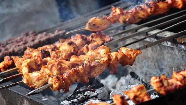 Man discussing BBQ competitions in Northwest Arkansas, podcast setting.