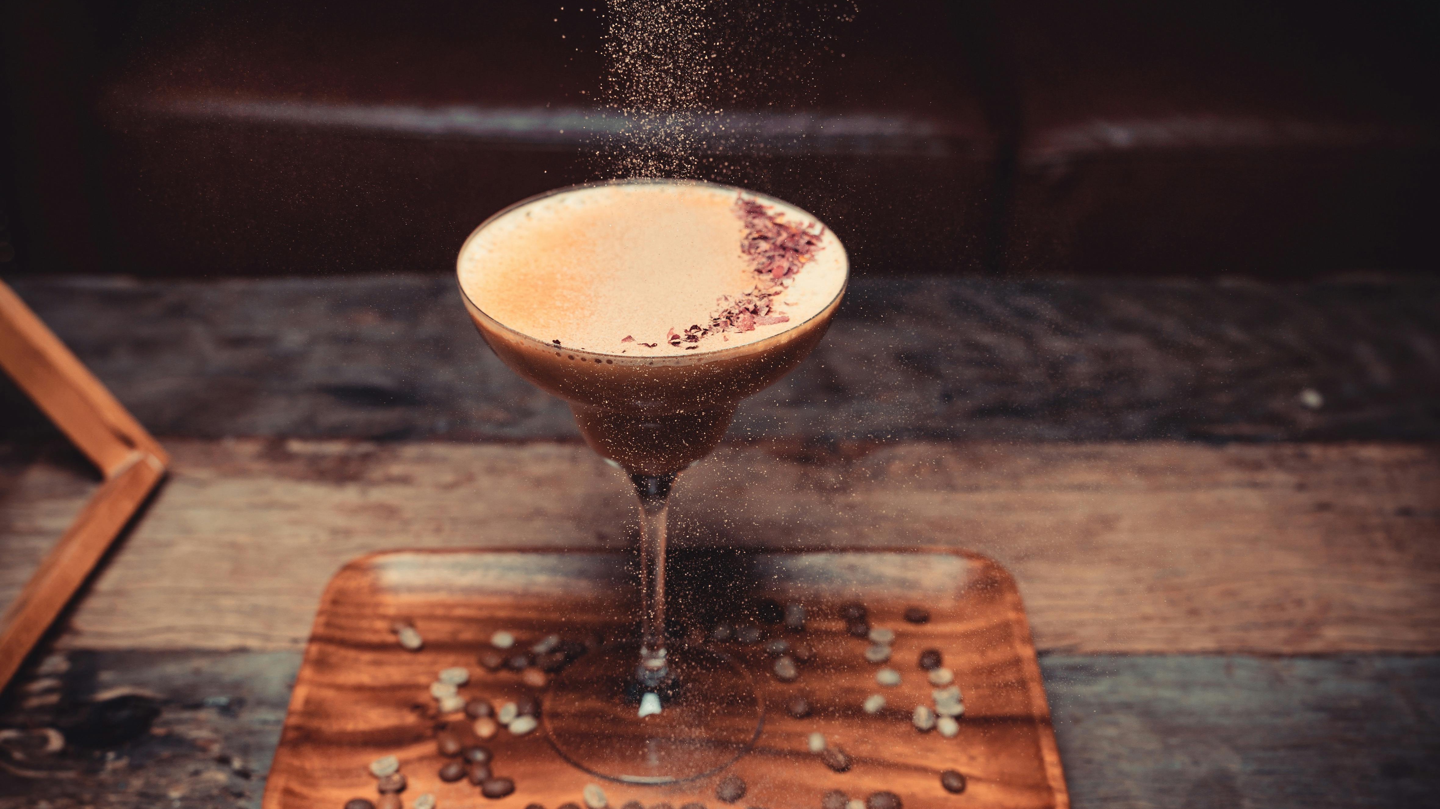 Cheerful woman in an ice cream parlor passionately speaking, Espresso Martini Gelato discussion.