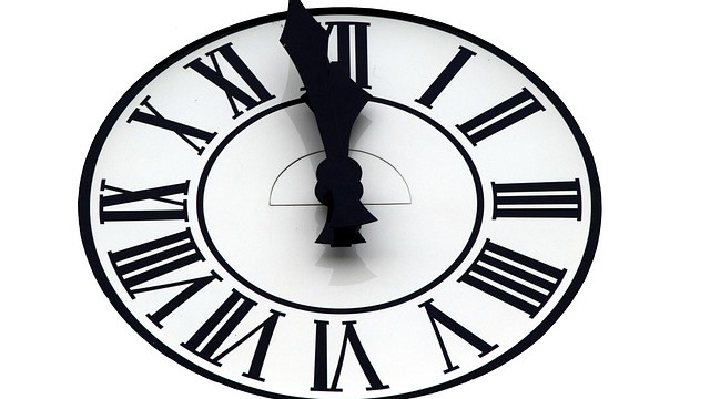 Futuristic digital clock for Tick Tock Day with binary code background.