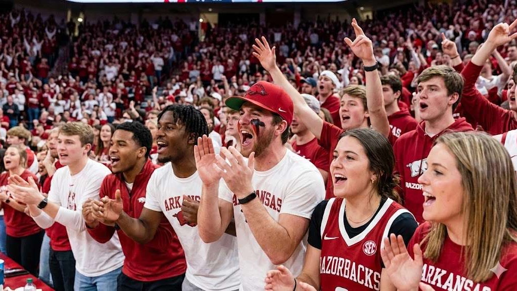 Passionate Arkansas Razorbacks coach with players during March Madness.