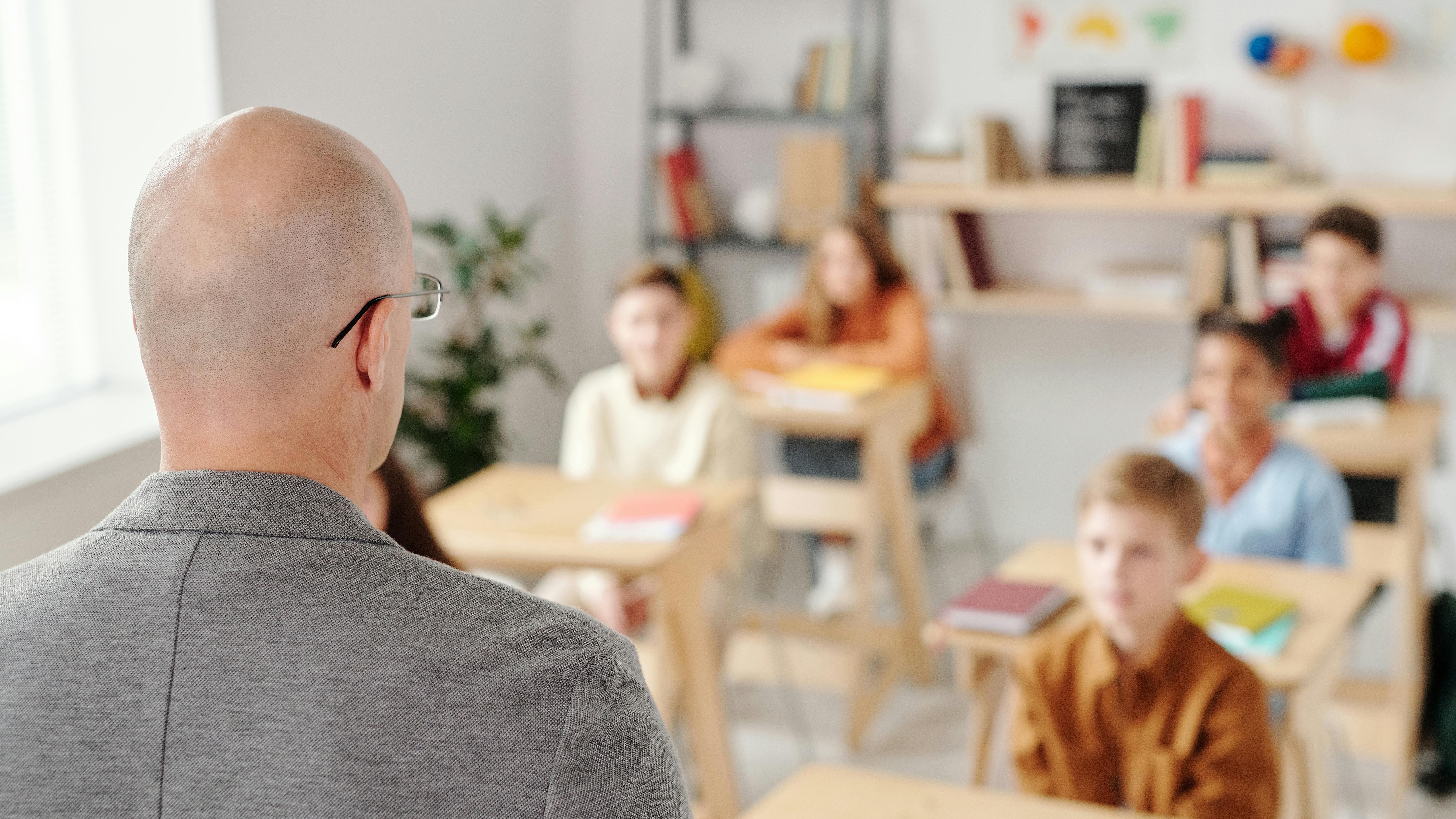 Ramay Jr. High land proposal site with cleared area beside road.
