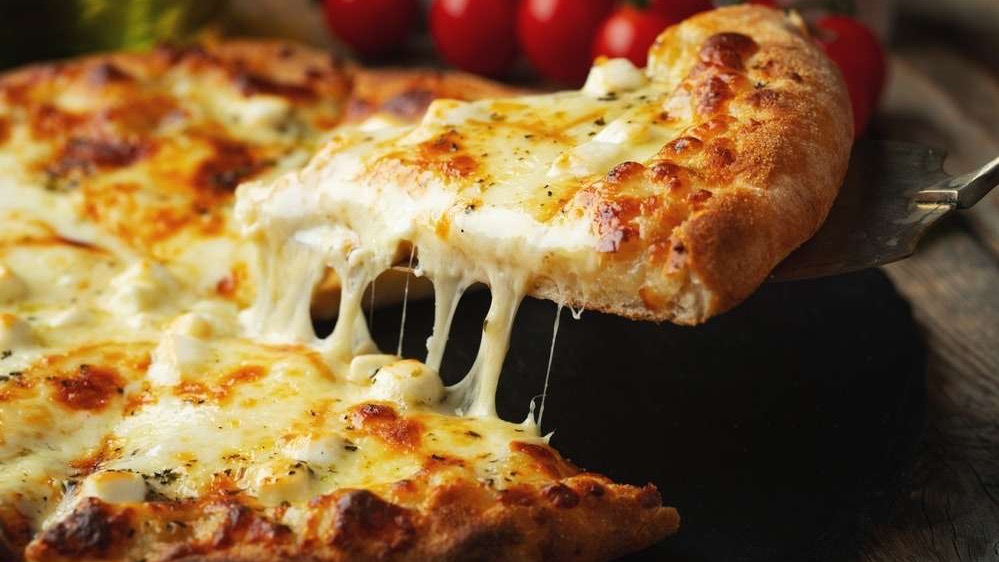 Man discussing Ria Pizza Downtown Rogers features.