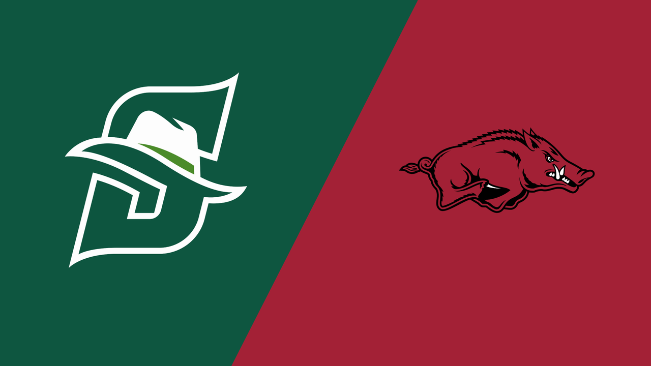 Arkansas Razorbacks players at press conference in team uniforms.