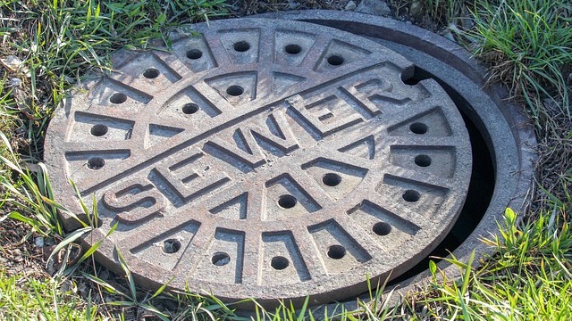 Playful graphic about sewer problems in Bentonville with blue and orange design