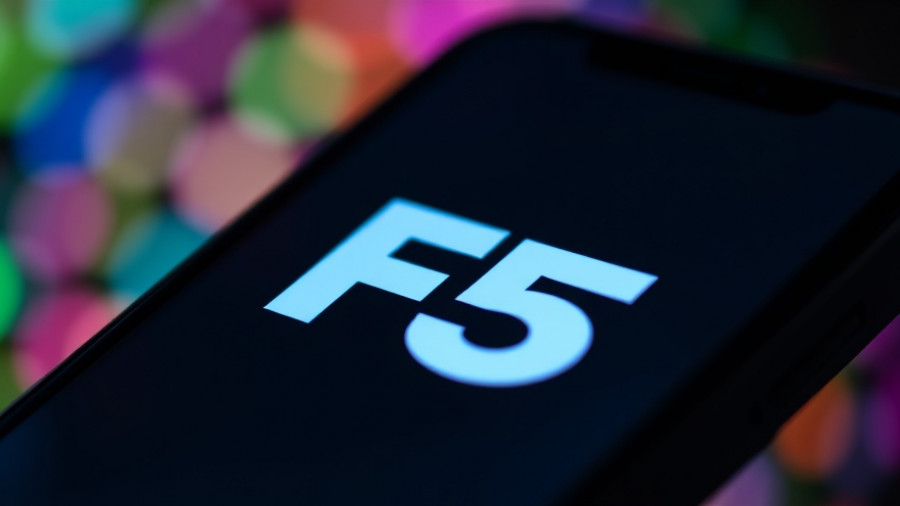 F5 logo on smartphone screen with blurred colorful background.