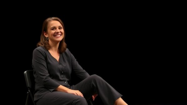 Smiling woman on stage at Planned Parenthood Awards Dallas.