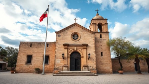 Historic mission facade with flagpole highlighting Texas cannon preservation
