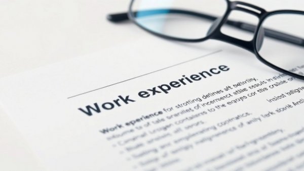 Close-up of resume and employment contract highlighting years of experience in hiring.