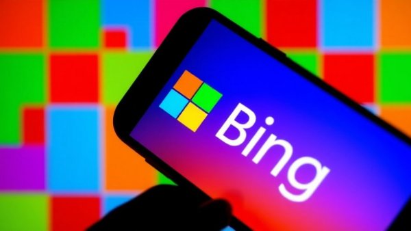 Smartphone displaying Microsoft Bing logo, vibrant tech-themed.