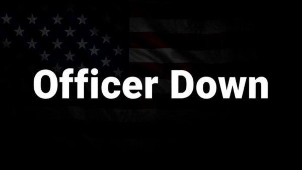 Officer Down text on dark US flag background, symbolizing officer safety.