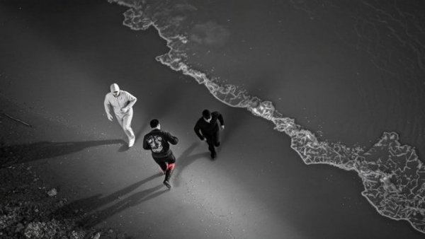 Infrared view of California police pursuit incident along shoreline.