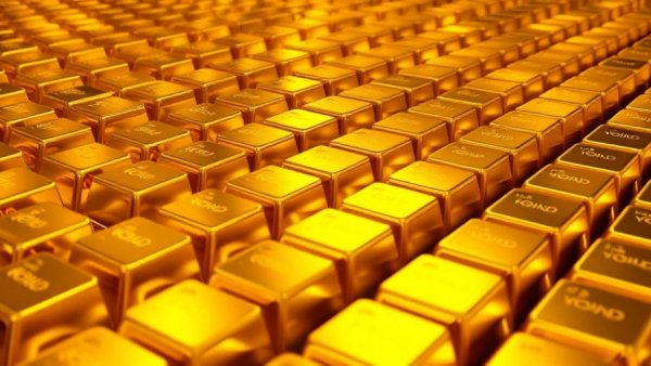 Stacks of gold bars representing gold inflation hedge.