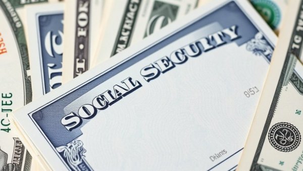Social Security card with US bills highlighting COLA increase.