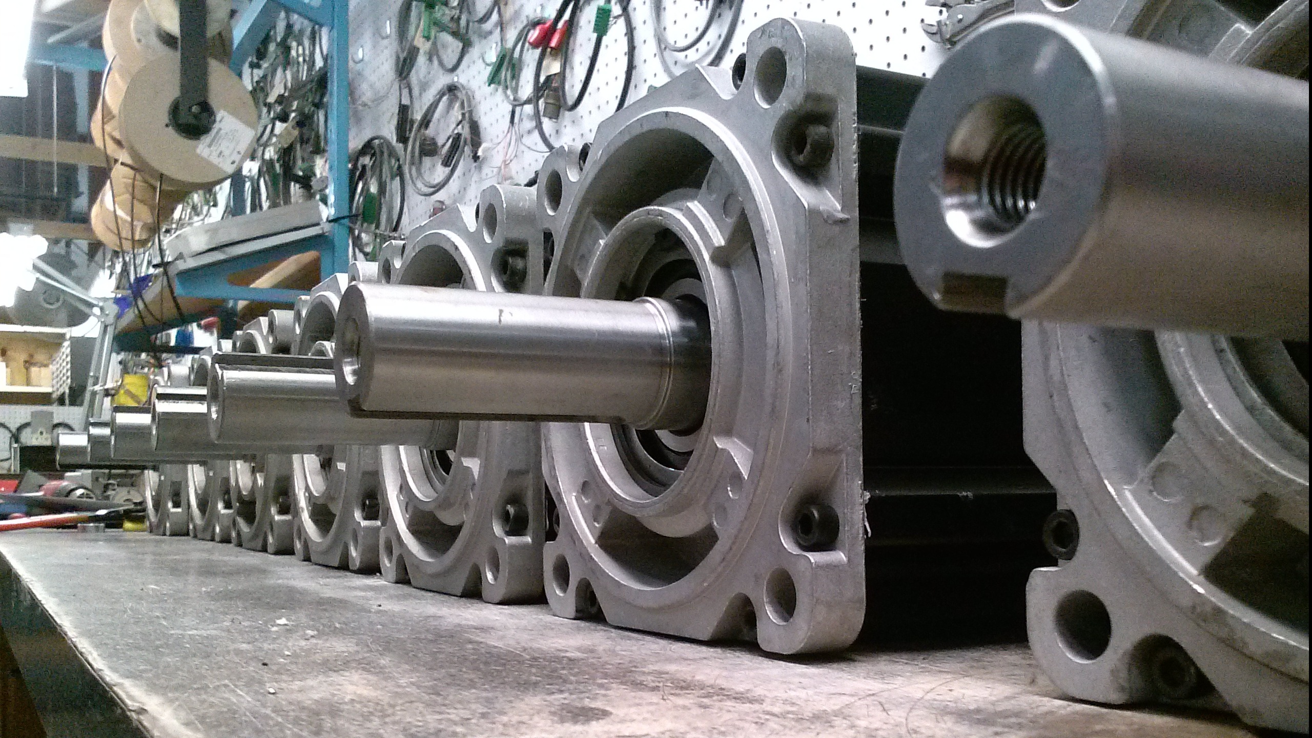 Industrial factory floor with advanced servo motors in operation, clean workspace, photorealistic with sharp depth of field, emphasizing servo motor repairs and high-tech equipment.