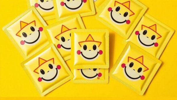 Bright yellow Starface acne care packaging with smiley faces.
