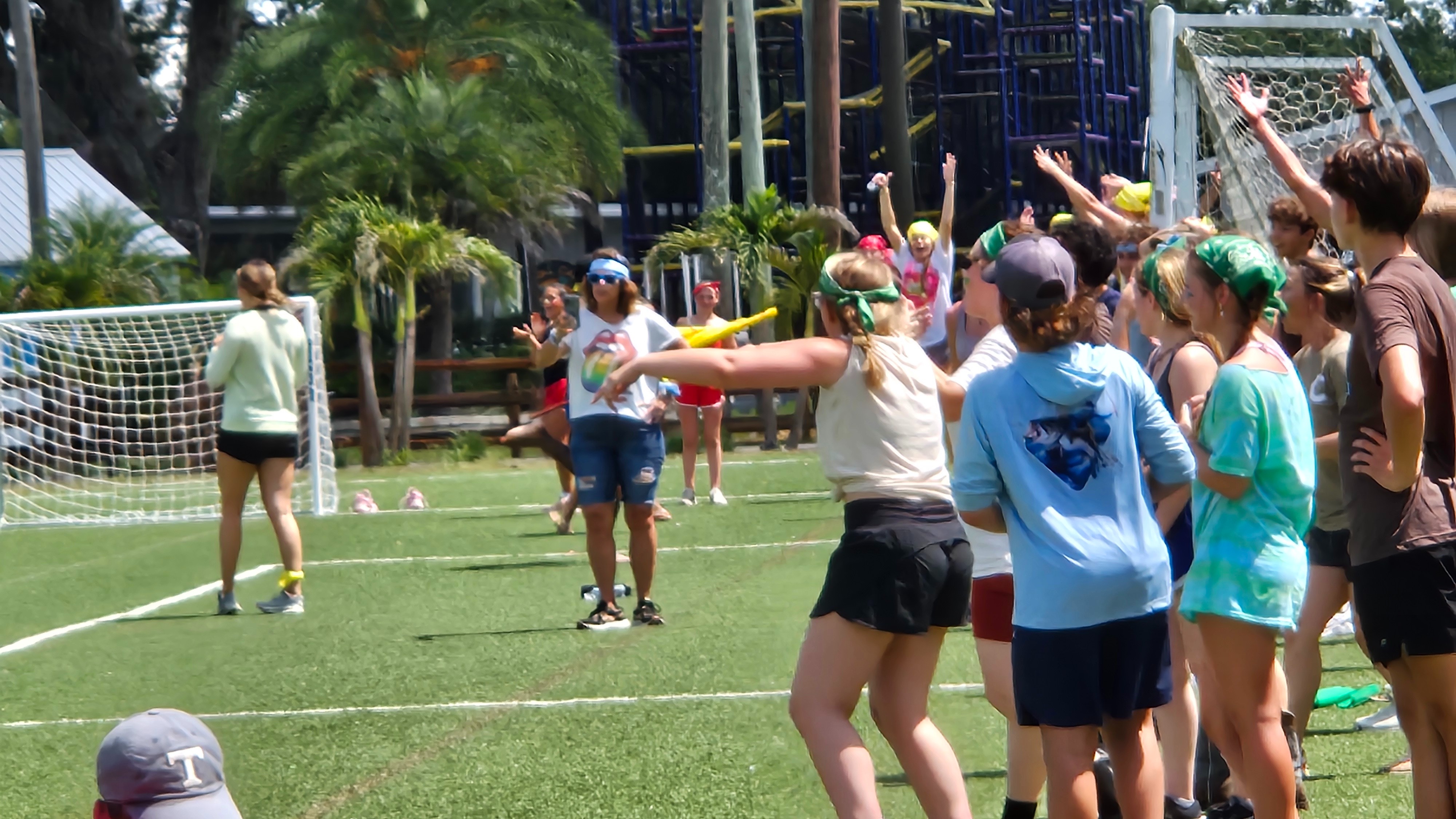 Youth playing soccer at Camp Impact, vibrant outdoor field surrounded by live oak trees in Central Florida, faith-focused youth church camp central florida.