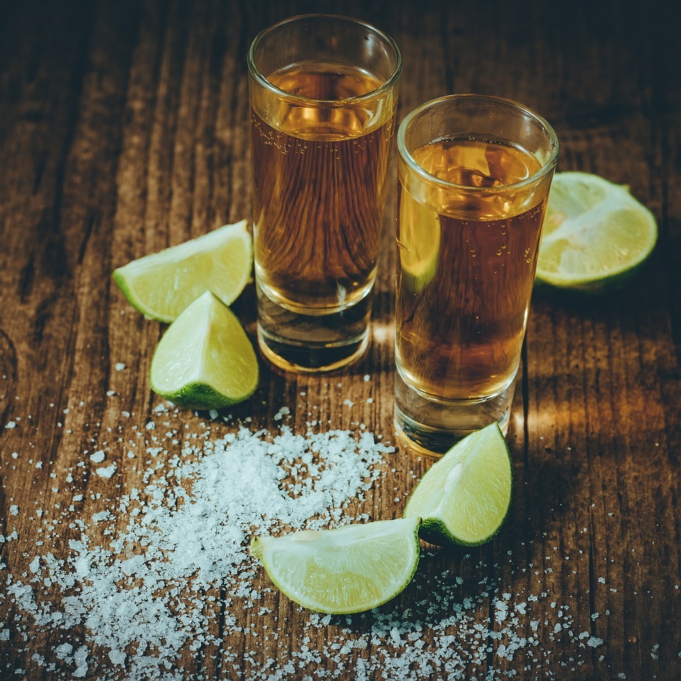 shots of tequila with salt and limes